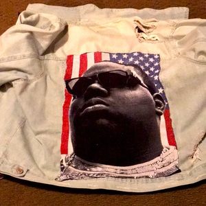 Distressed jean jacket with biggie on the back patches all over